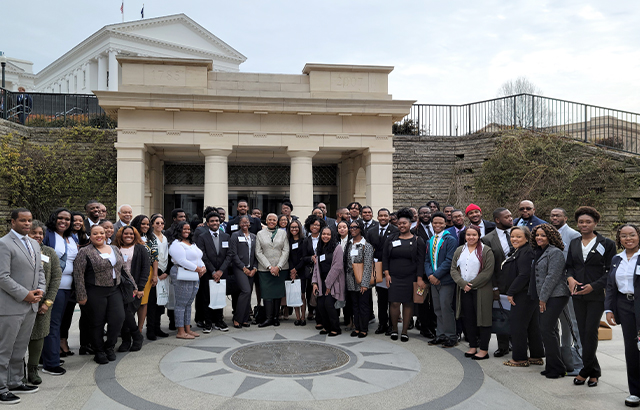 spartan legion standing outside of the general assembly in a group photo