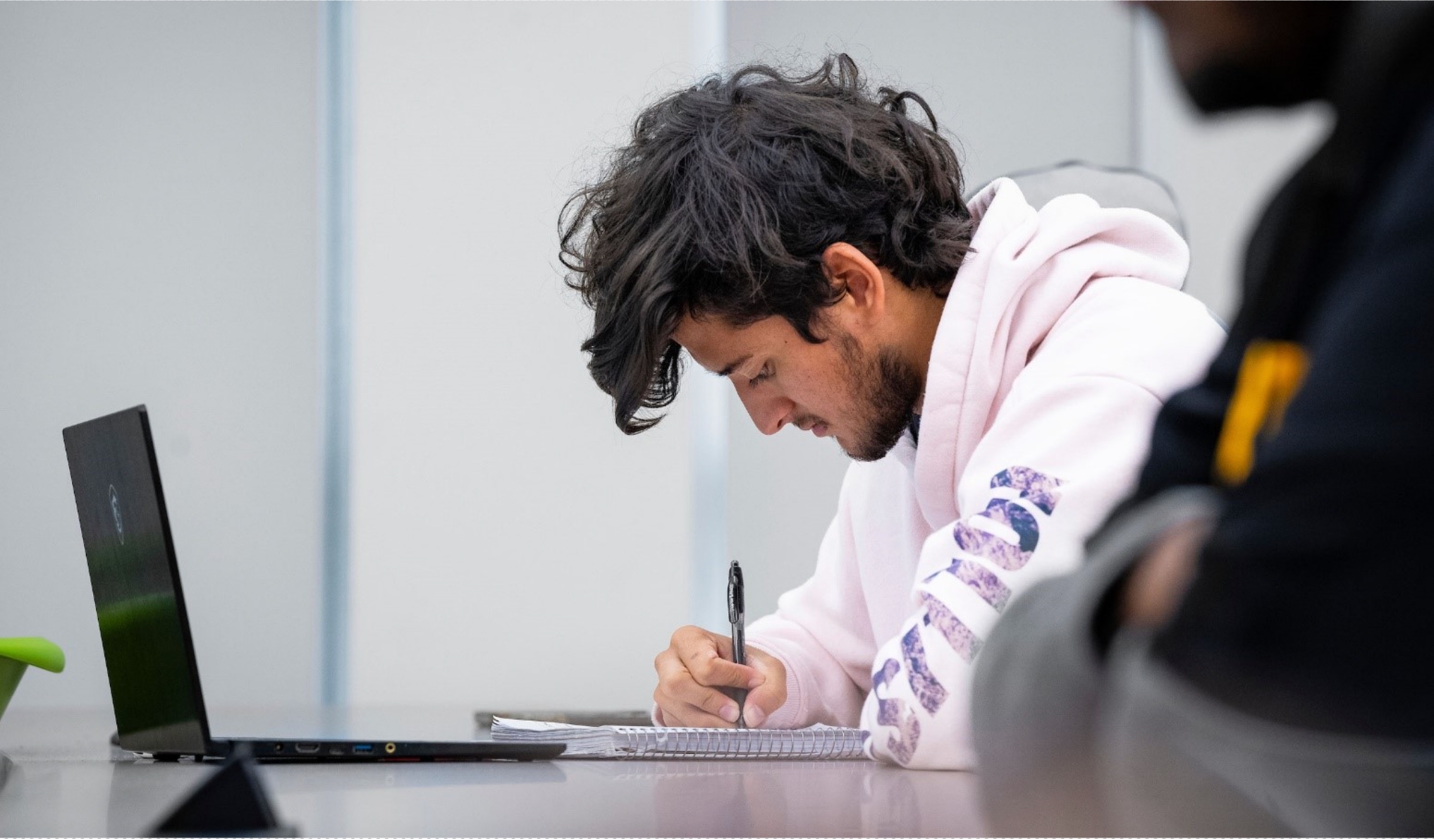 student looking at a laptop