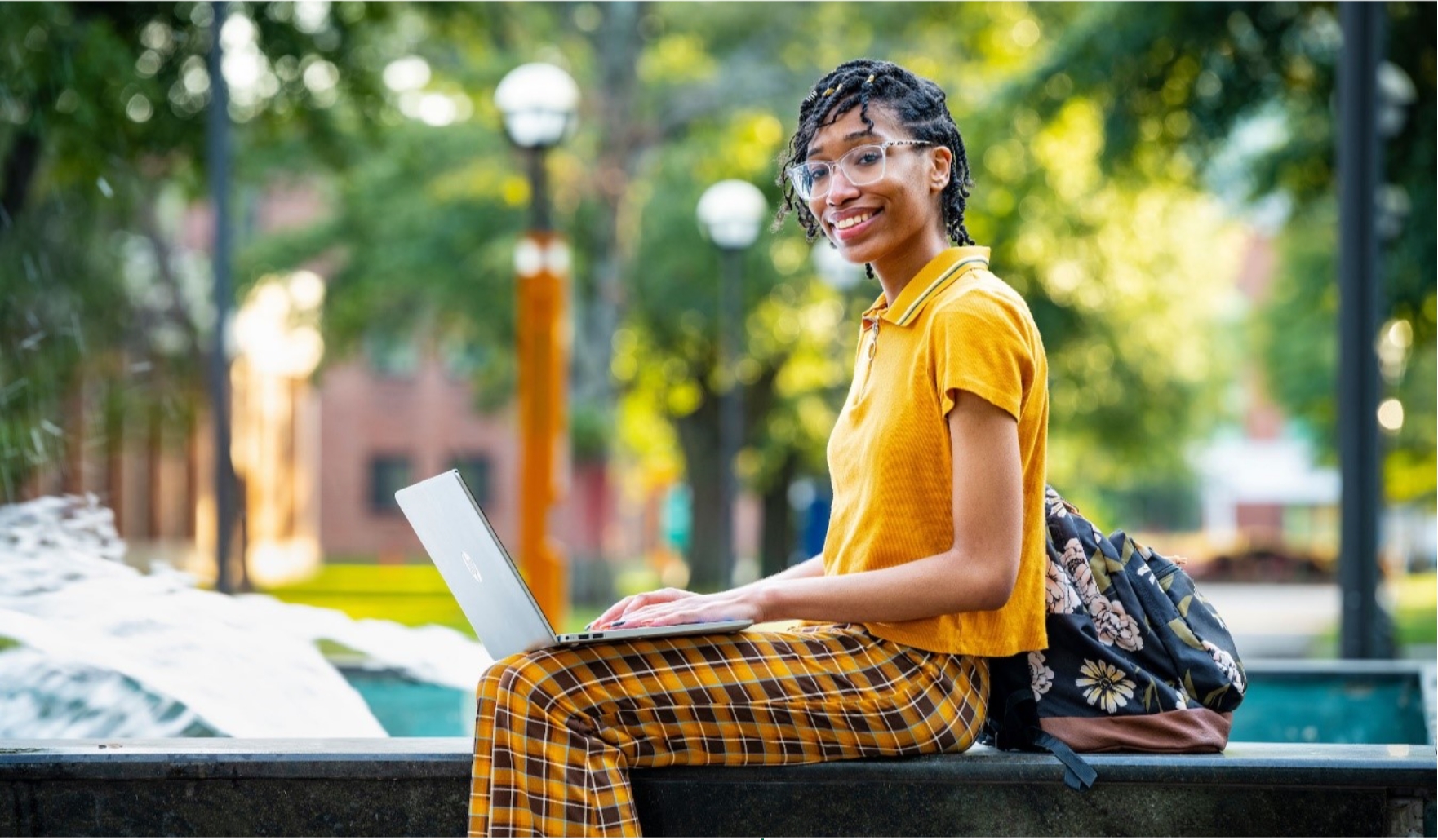 student looking at a laptop