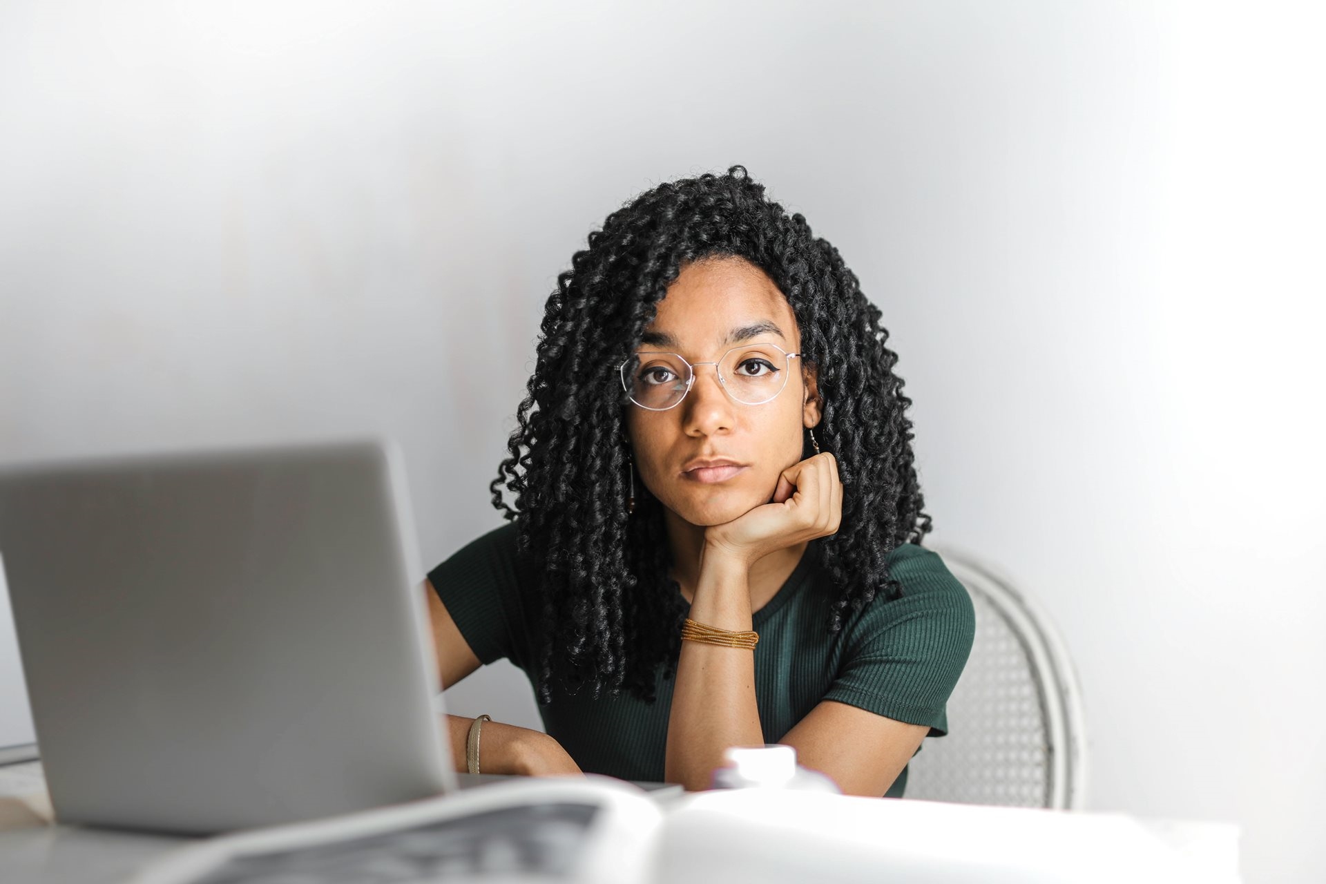 student in front of a laptop computer