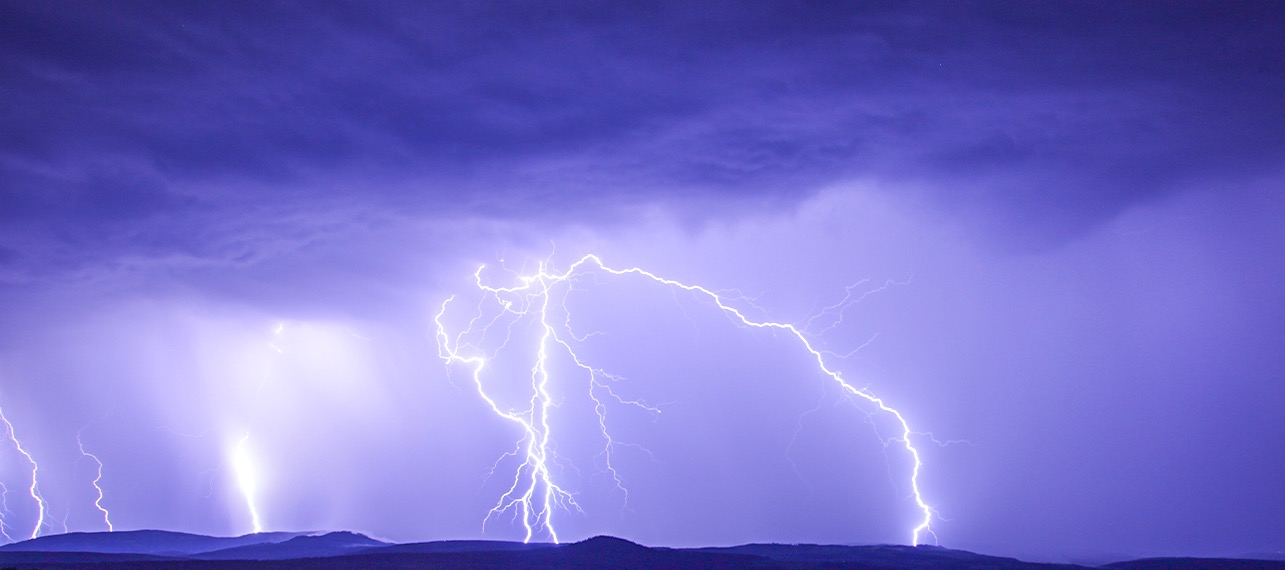 purple image with white lightning bolts