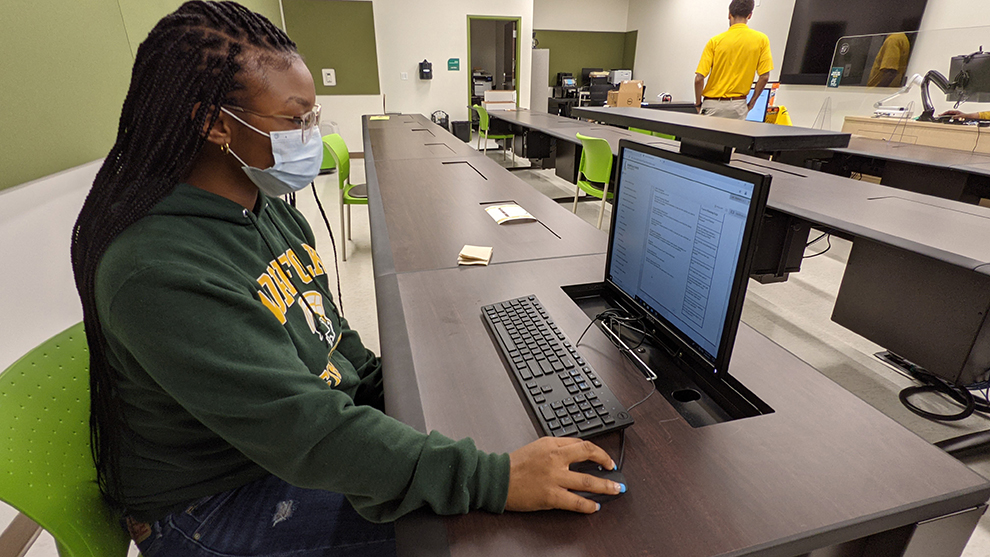 student in front of computer