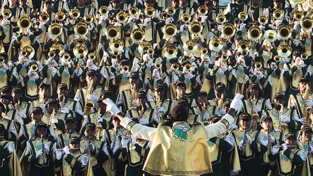NSU marching band playing music outside