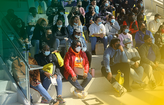 new students sitting in brown hall
