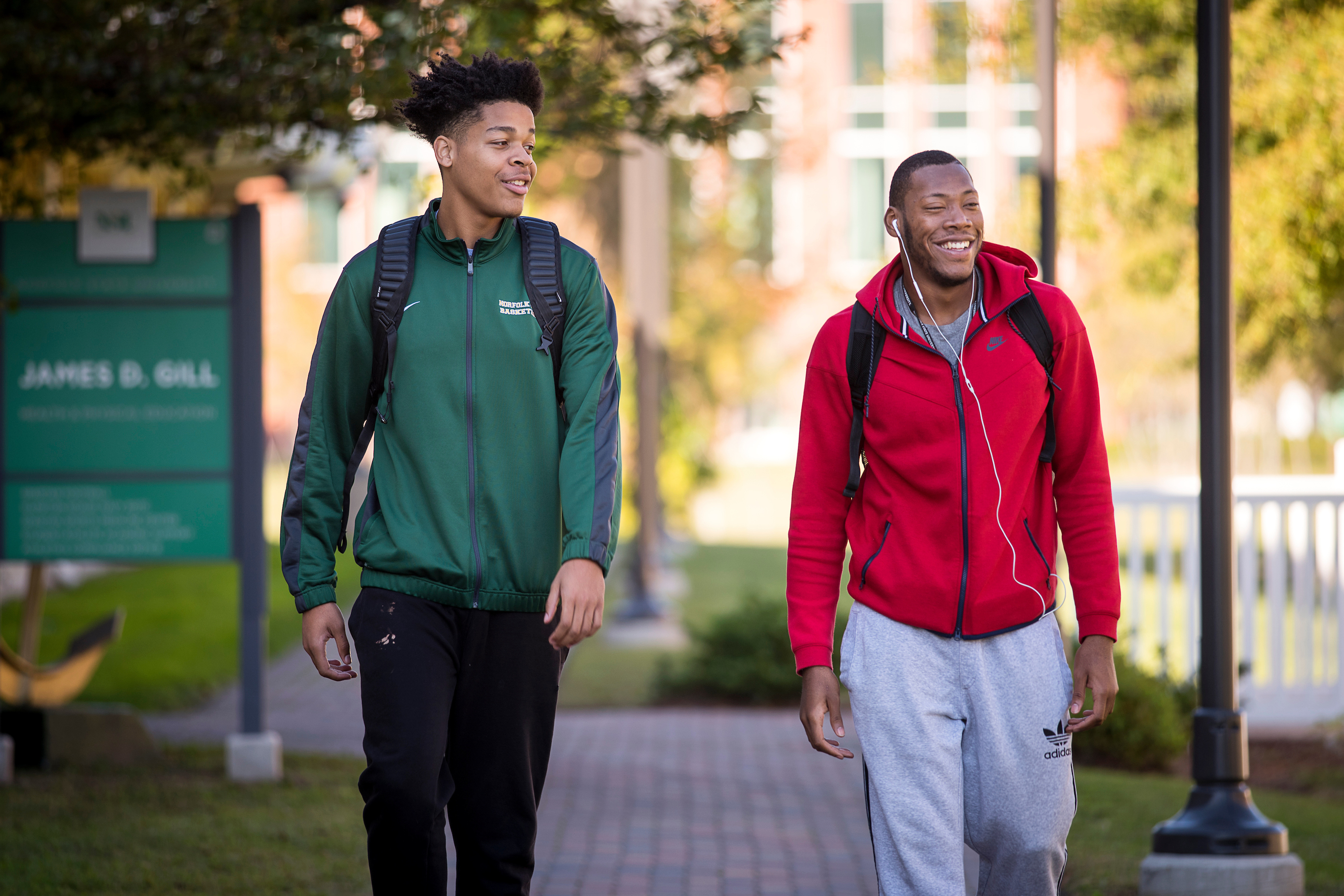 Two students walking on campus