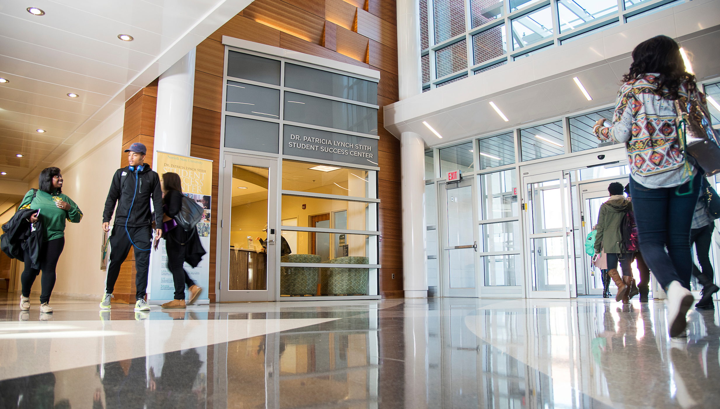 students walking in the nursing and general education building