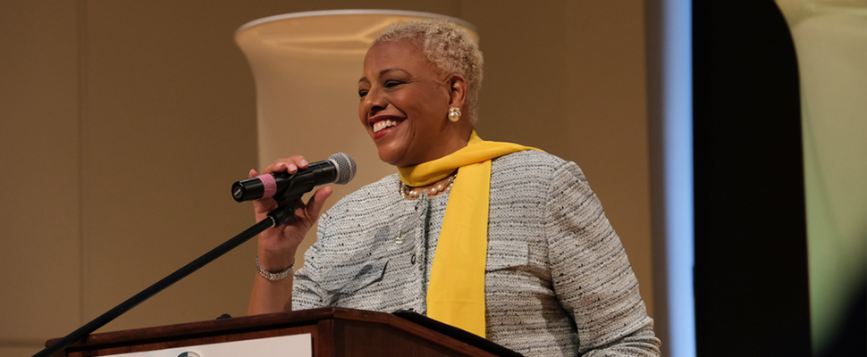 nsu president speaking  on a microphone