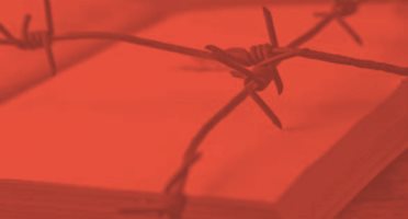 image of a book behind barb wired fence - with a red color overlay