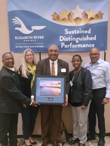NSU faculty posing with the Sustained Distinguished Service award from the Elizabeth River Project.