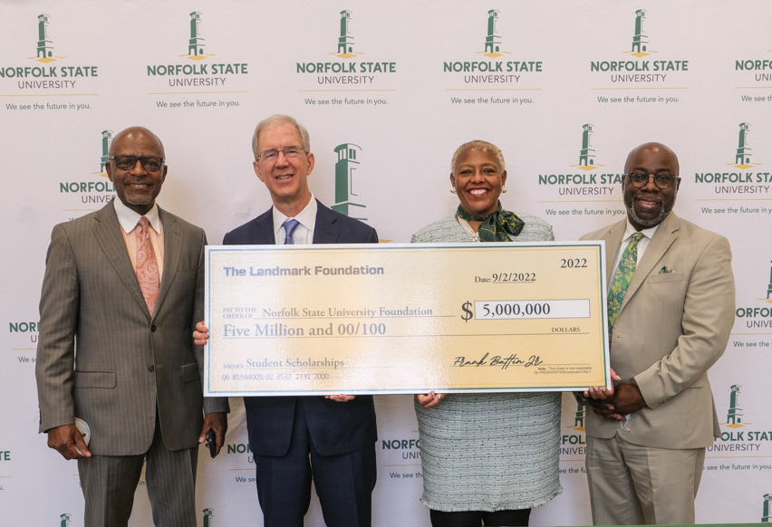 Gary McCollum, Frank Batten, President Adams-Gaston, and VP Porter hold a $5 million check from Landmark Foundation to NSU.