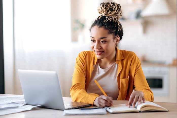 student in front of a laptop computer