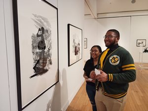 NSU student view "Cut to the Quick" art works by Kara Walker.