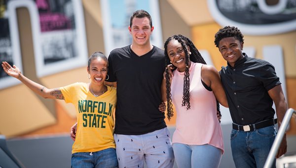 group photo of NSU students in front of the Norfolk sign