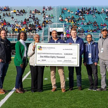 president presented with a 1 million dollar check