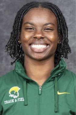 student wearing a green NSU top