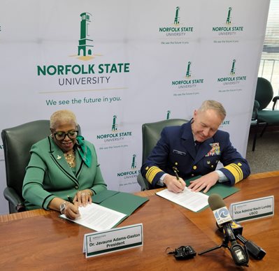Dr. Javaune Adams-Gaston, NSU President, and Vice Admiral Kevin Lunday, USCG, sign a memorandum of understanding March 23, 2023.