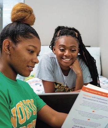 students reading a pamphlet together