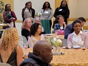 Media professionals, NSU staff and students, listen to speakers at the media reception.