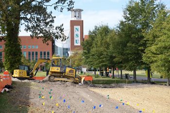 excavator used to level the soil to plant new shrubs and trees on NSU campus