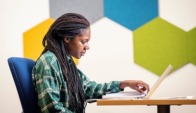 one student studying in front of a laptop