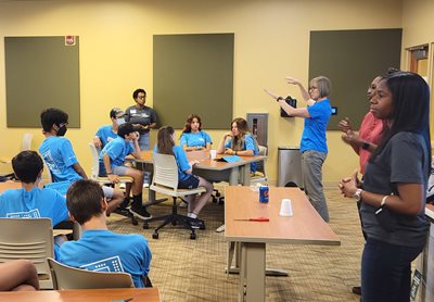 Campers receive instruction from camp director Cathy Ammirati.