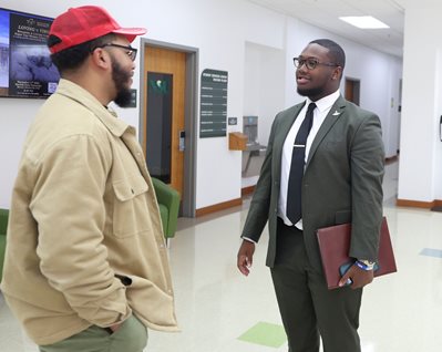 jaylin and another student talking in the hallway