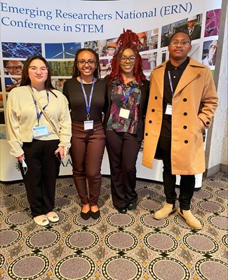 The students from left to right are: Tricia Camaya (Computer Science undergraduate), Jasmine Lambert, Tamia King, and Deandre Bradley (Criminal Justice graduate students).
